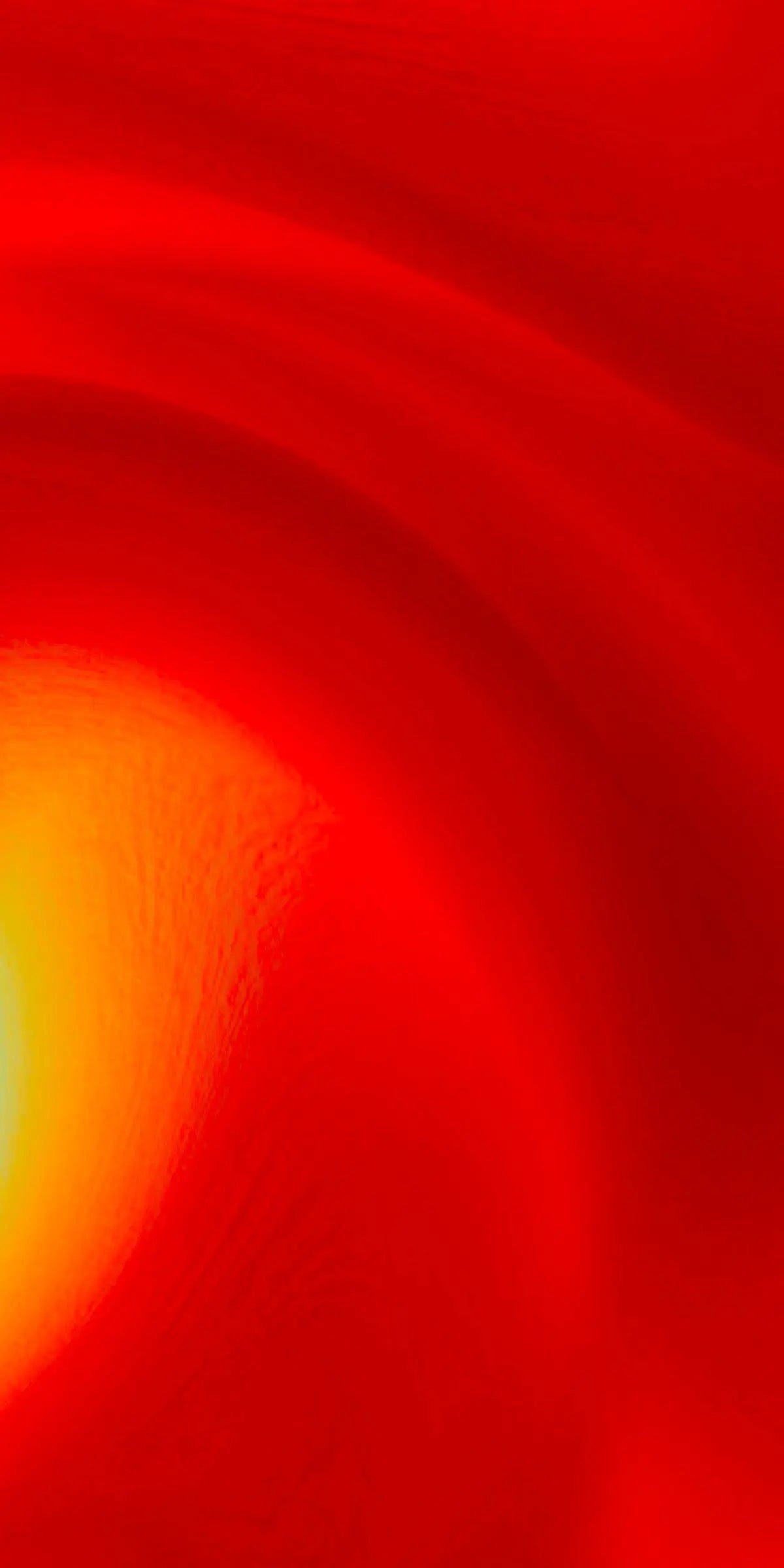 A female model heading a red light therapy wand next to her face.